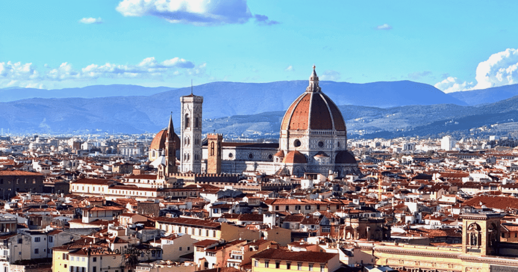 Florence skyline featuring Cathedral and mountains.