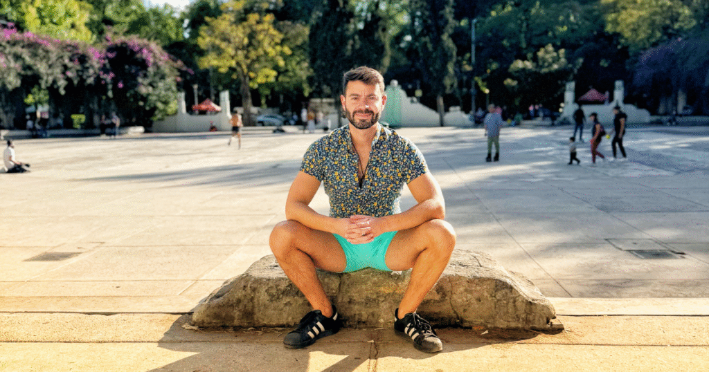 Man sitting in park on sunny day